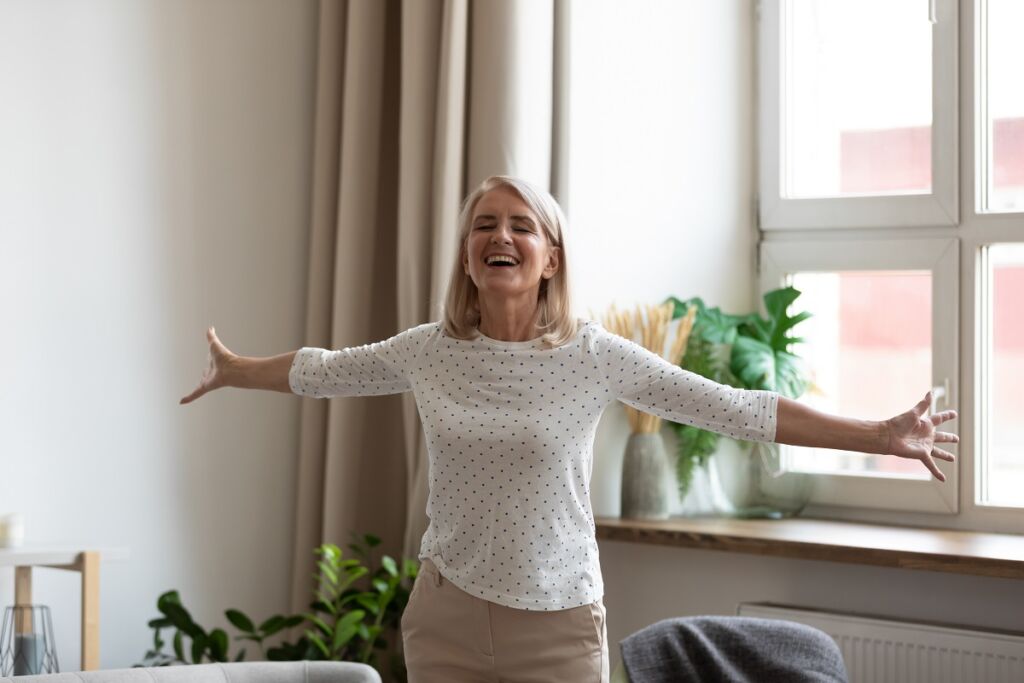 Happy,Mature,Female,Pensioner,Stand,With,Arms,Open,Feel,Positive